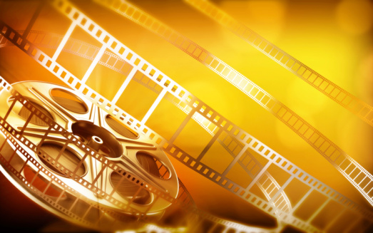 Cinema film reel (gold colors)