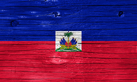Haitian flag on wood texture.
