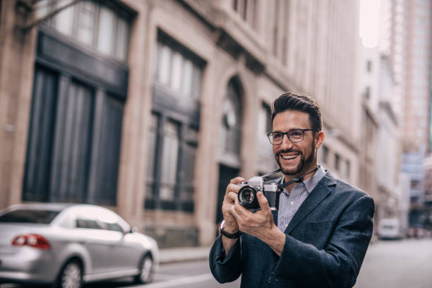istock Photographer in city 1042554488