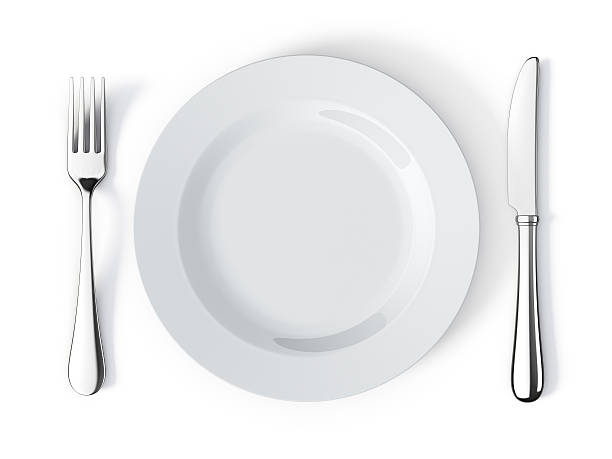 Place setting with plate, knife and fork Top view of place setting with plate, knife and fork plate and fork stock pictures, royalty-free photos & images