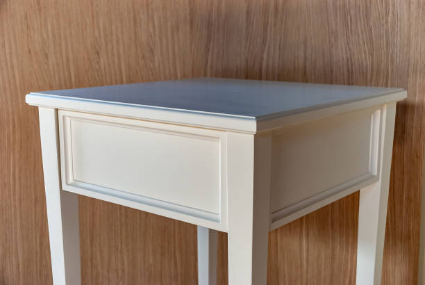 istock White bedside table in solid wood. Classic furniture 1042559452