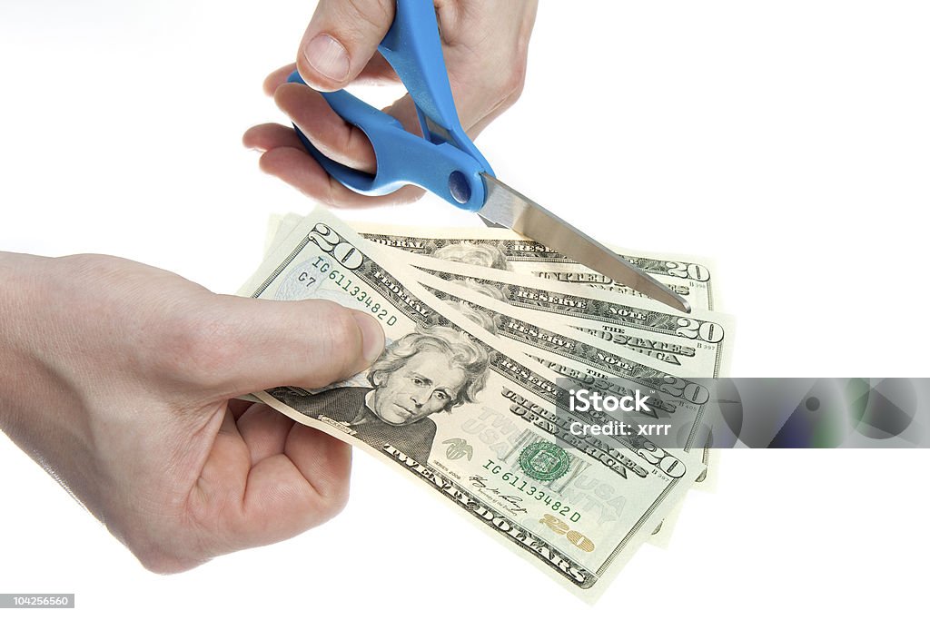 Cutting Costs  American Twenty Dollar Bill Stock Photo