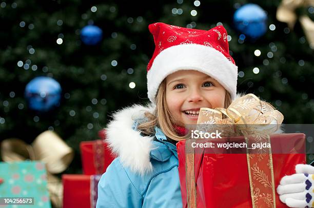 Little Girl At Christmas Time Stock Photo - Download Image Now - Beautiful People, Box - Container, Cap - Hat