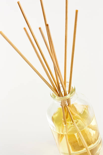 istock Aromatherapy oils in a glass jar with bamboo sticks 104256609