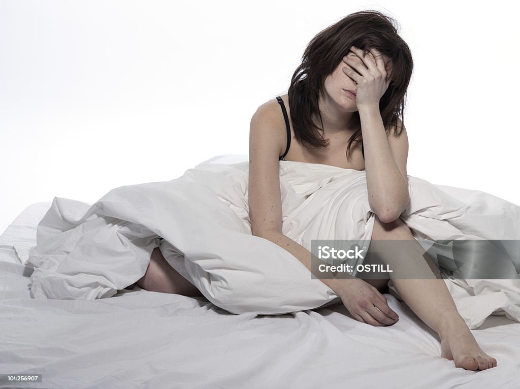 woman in bed rude awakening tired exhausted  Adult Stock Photo