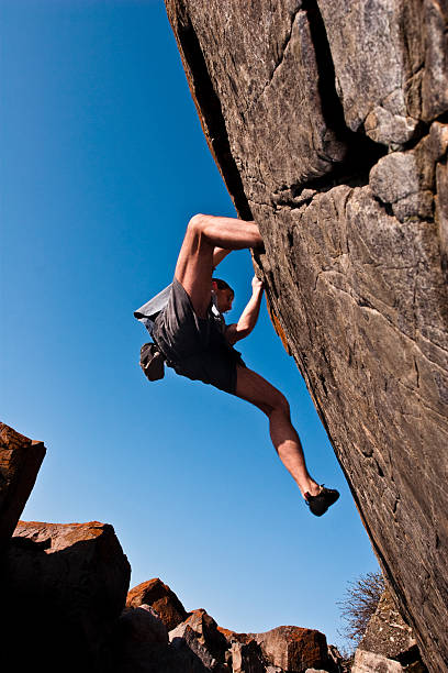 istock Rock climbing on the shore 104257060