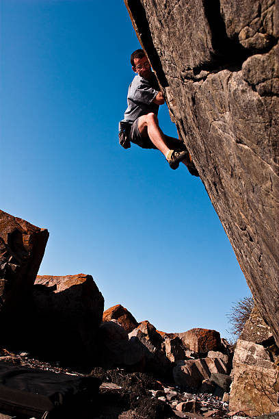 istock Rock climbing on the shore 104257070