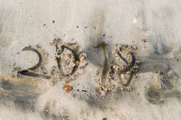 istock ugly and clumsy letters 2018 on sandy beach 1042574610