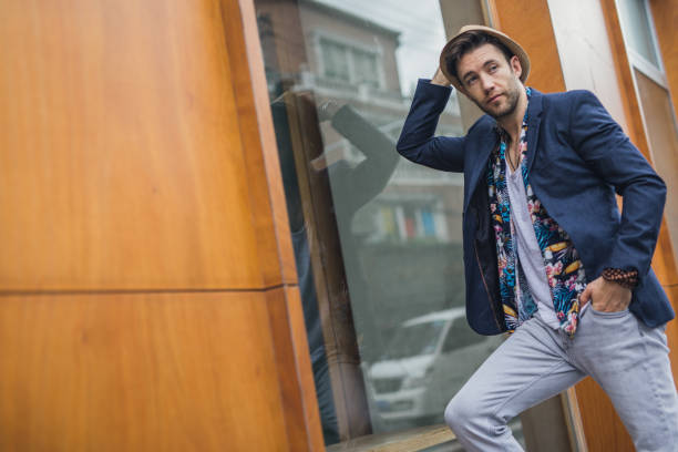 One man, handsome modern young man on the city street.
