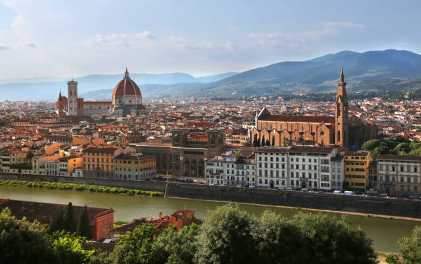 View of Cathedral of Santa Maria del Fiore (Florence Cathedral) and Basilica of Santa Croce during evening as viewed from Piazzale Michelangelo in Florence (Firenze), Tuscany, Italy stock photo