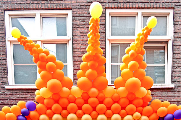 istock Typical dutch: Orange crown from balloons against a house  facade 104258977