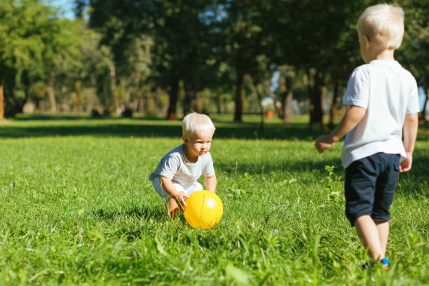 istock Attentive boys playing with a ball outside 1042589974