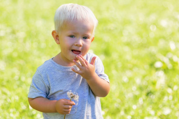 istock Thoughtful serious kid standing in the garden 1042590150