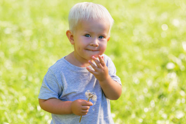 istock Shy kid having fun in the garden 1042590152