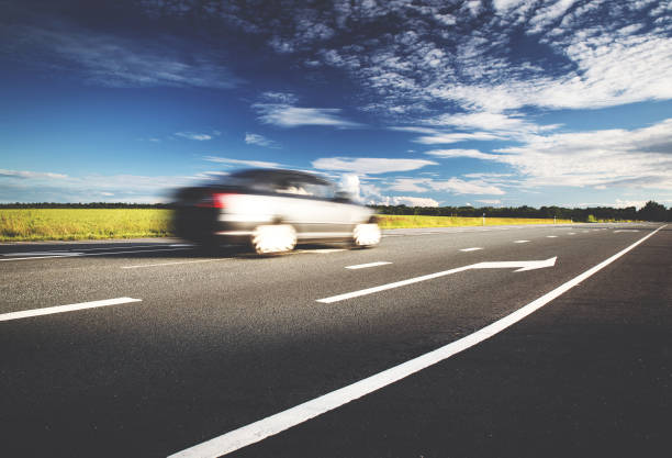 istock Car on asphalt road in beautiful spring day 1042598592