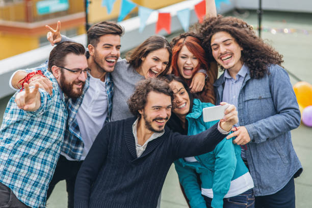 istock Friends taking selfie on the rooftop 1042599010