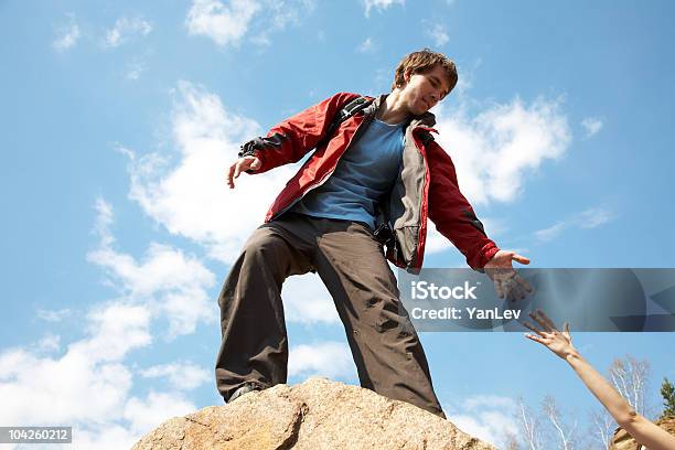 Instructor Handed Someone A Helping Hand Stock Photo - Download Image Now - Assistance, Hiking, Men