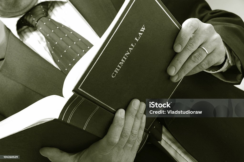 lawyer holding criminal law book  Book Stock Photo