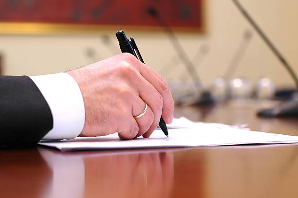 istock Close-up of man signing a contract 104260549
