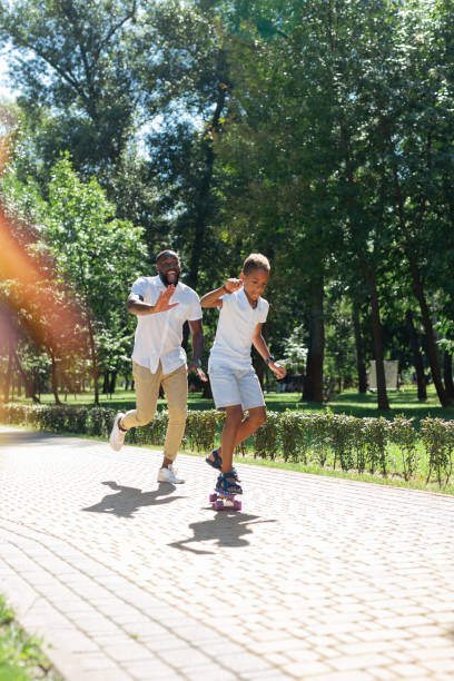 istock Nice pleasant man running after his son 1042610264