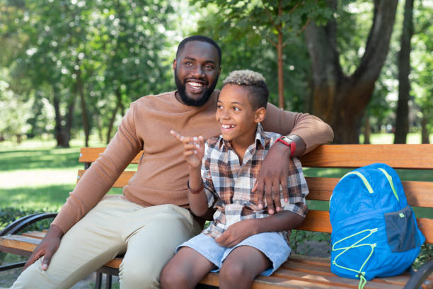 istock Cute happy boy pointing with his finger 1042610398
