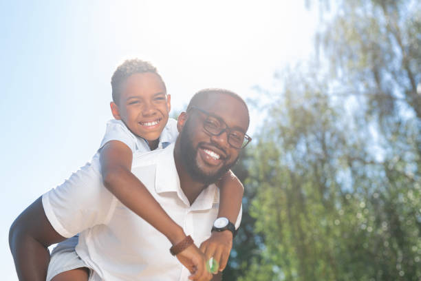 istock Positive joyful man enjoying his time with son 1042610650