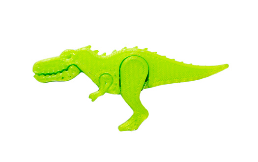 Bright light green object in shape of dinosaur toy printed on 3d printer isolated on white background. Fused deposition modeling, FDM. Concept modern progressive additive technology for 3d printing.