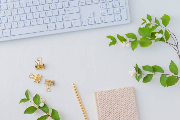 istock Flat lay desk and branch with green leaves 1042610748