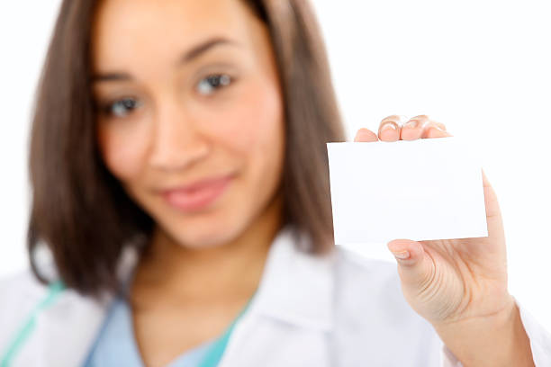 istock Doctor holding blank card 104261103