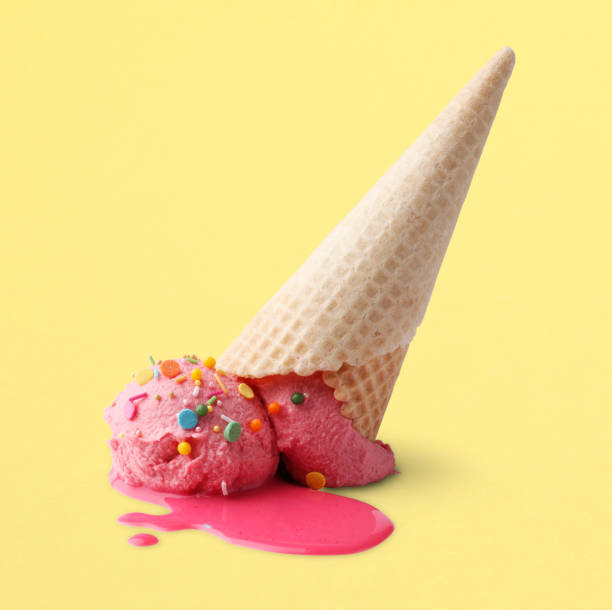 Upside Down Ice Cream Upside down ice cream cone squashed onto a yellow surface. Clipping path included. ice cream cone photos stock pictures, royalty-free photos & images