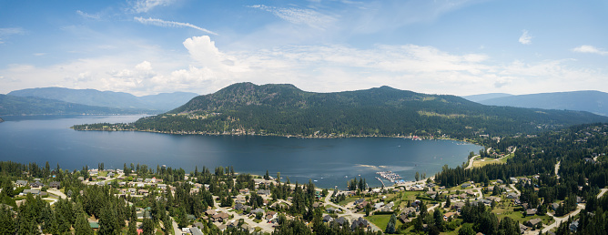 Aerial panoramic view of a little town, Blind Bay, during a vibrant sunny summer day. Taken in the Interior BC, Canada.