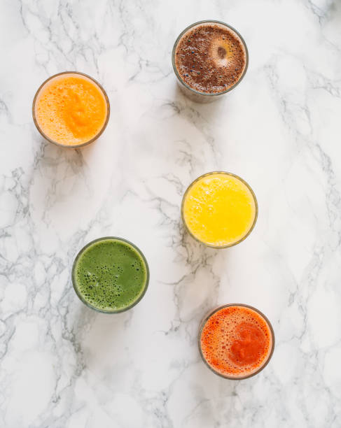 istock Colorful smoothies in glass with fresh tropical fruit and superfoods 1042617536