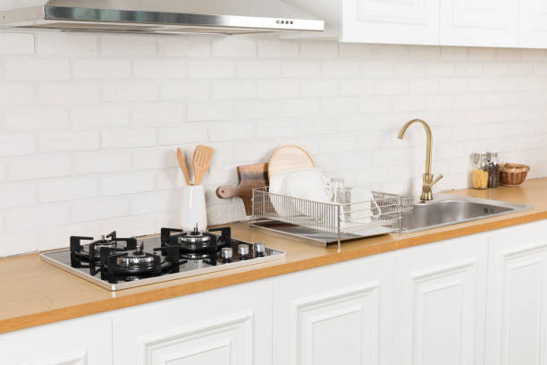 istock Kitchen utensils and dishware on wooden shelf. Kitchen interior background.Text space. 1042617646