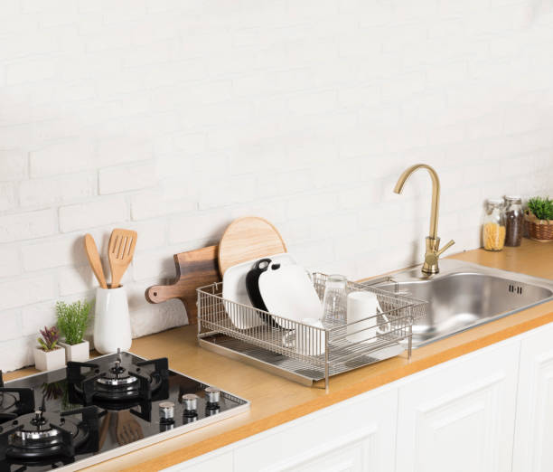 istock Kitchen utensils and dishware on wooden shelf. Kitchen interior background.Text space. 1042617650