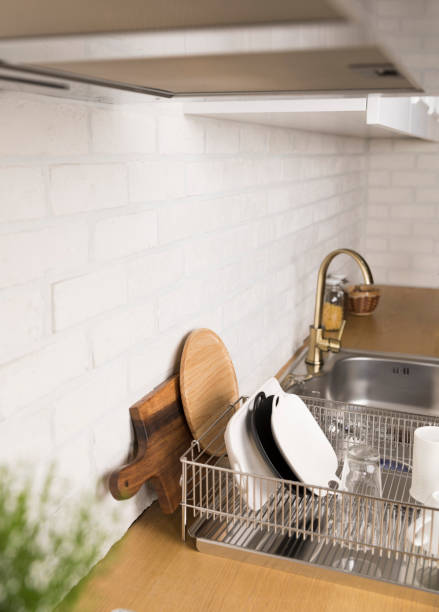 istock Kitchen utensils and dishware on wooden shelf. Kitchen interior background.Text space. 1042617948