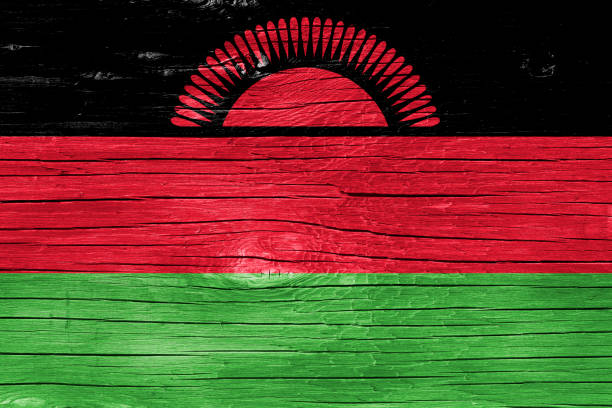 Malawian flag on wood texture.