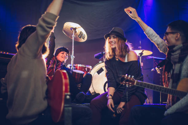 istock Cheerful musicians on stage 1042621386