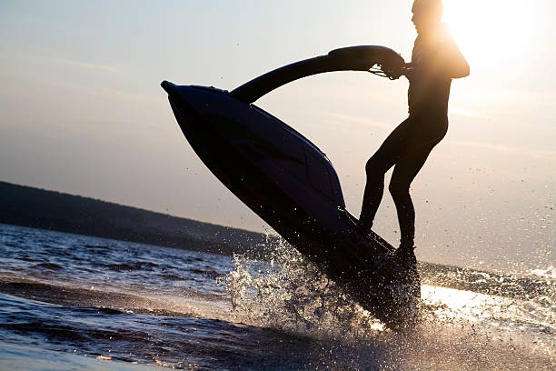 istock man jumps on the jetski 104263571