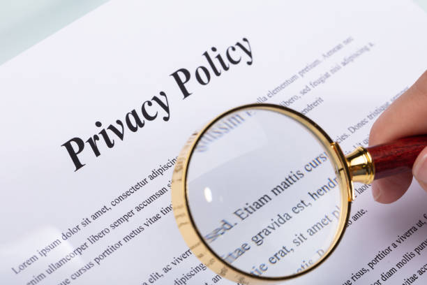 istock Woman Holding Pen Over Privacy Policy Form 1042650460