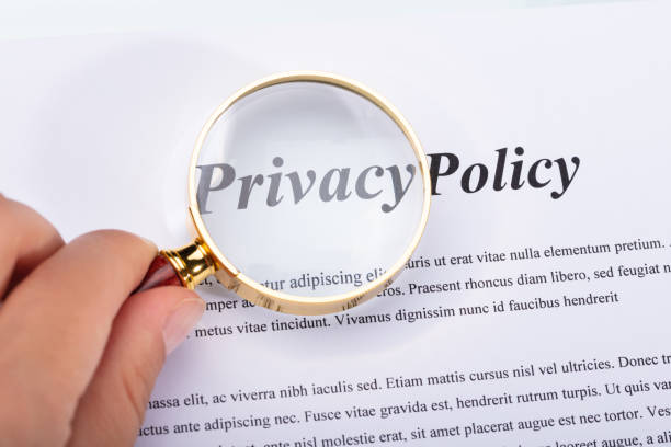 istock Woman Holding Magnifying Glass Over Privacy Policy Form 1042650486