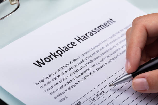 istock Woman Filling Workplace Harassment Form 1042650892