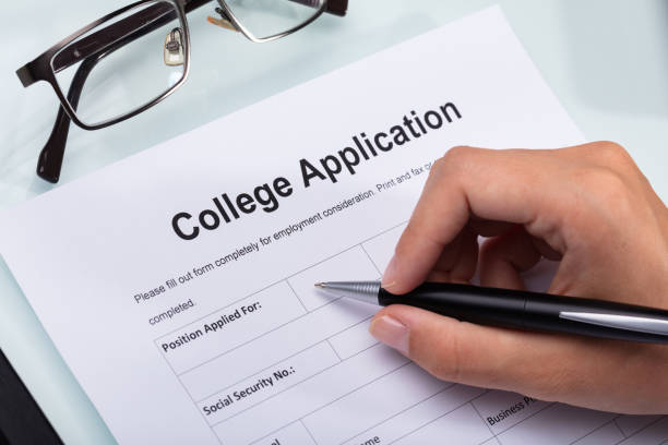 istock Person Filling College Application Form 1042650894