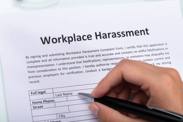 istock Woman Filling Workplace Harassment Form 1042650896