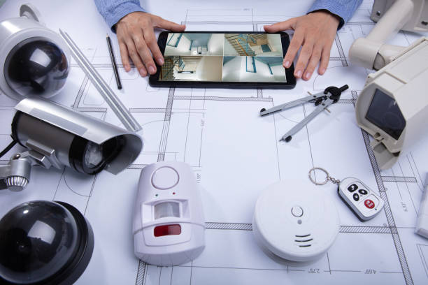 istock Architecture Looking At CCTV Footage On Digital Tablet 1042650928