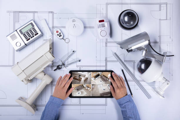 istock Architecture Looking At CCTV Footage On Digital Tablet 1042650938