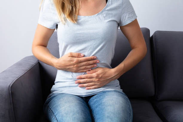 istock Woman Suffering From Stomach Pain 1042650988