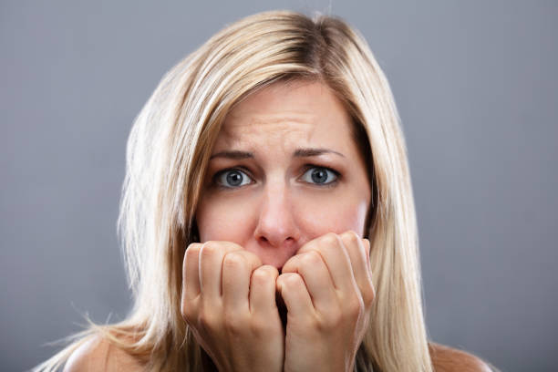 istock Portrait Of A Scared Woman 1042651136