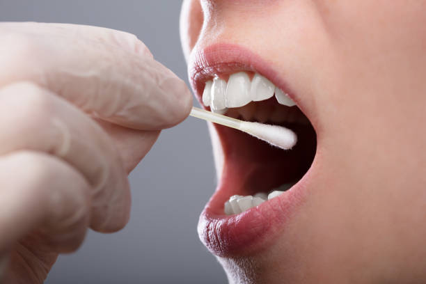 istock Woman Taking Saliva Test From Her Mouth 1042651472