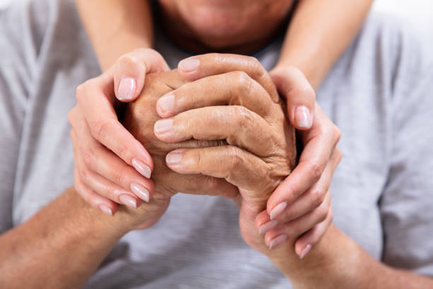 istock Daughter Holding Hands Of Her Father 1042652240