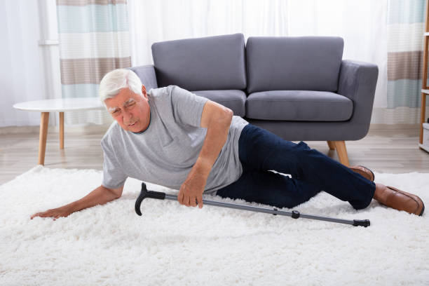 istock Senior Man Fallen On Carpet 1042652294